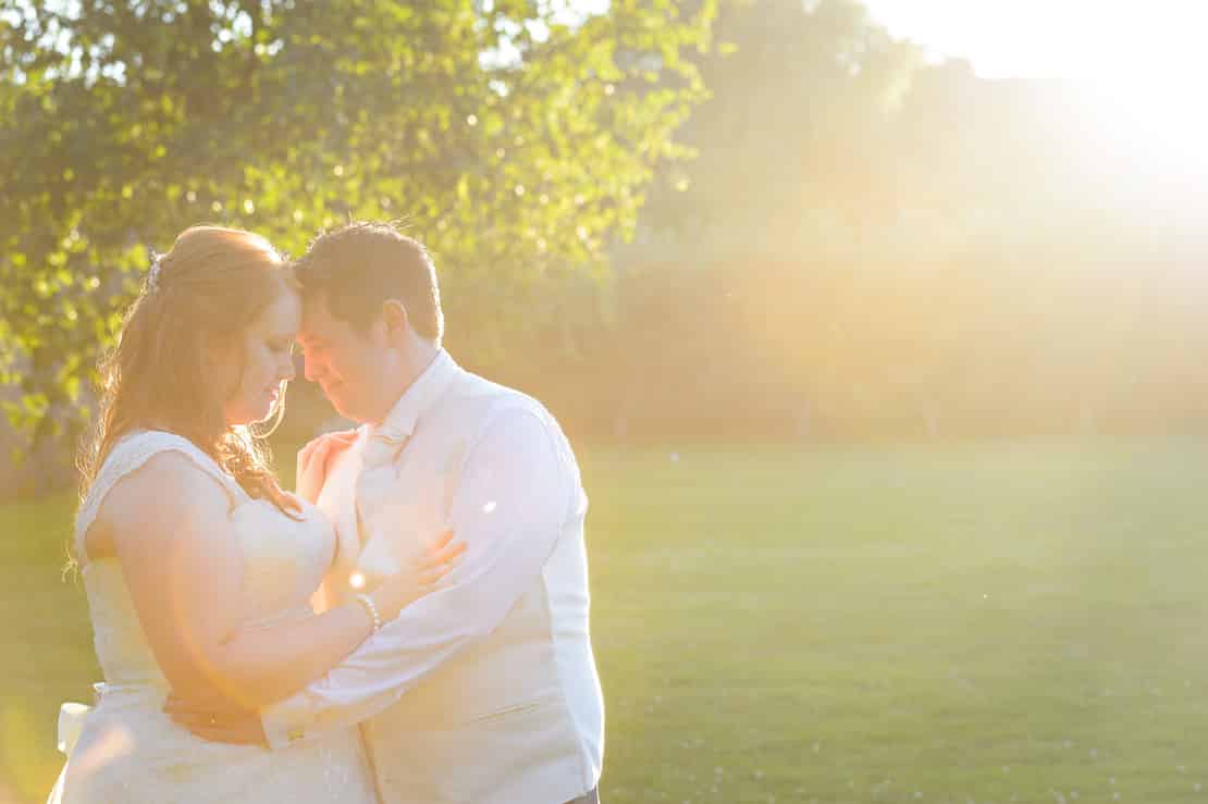 Posed Wedding Couple with Lens Flare